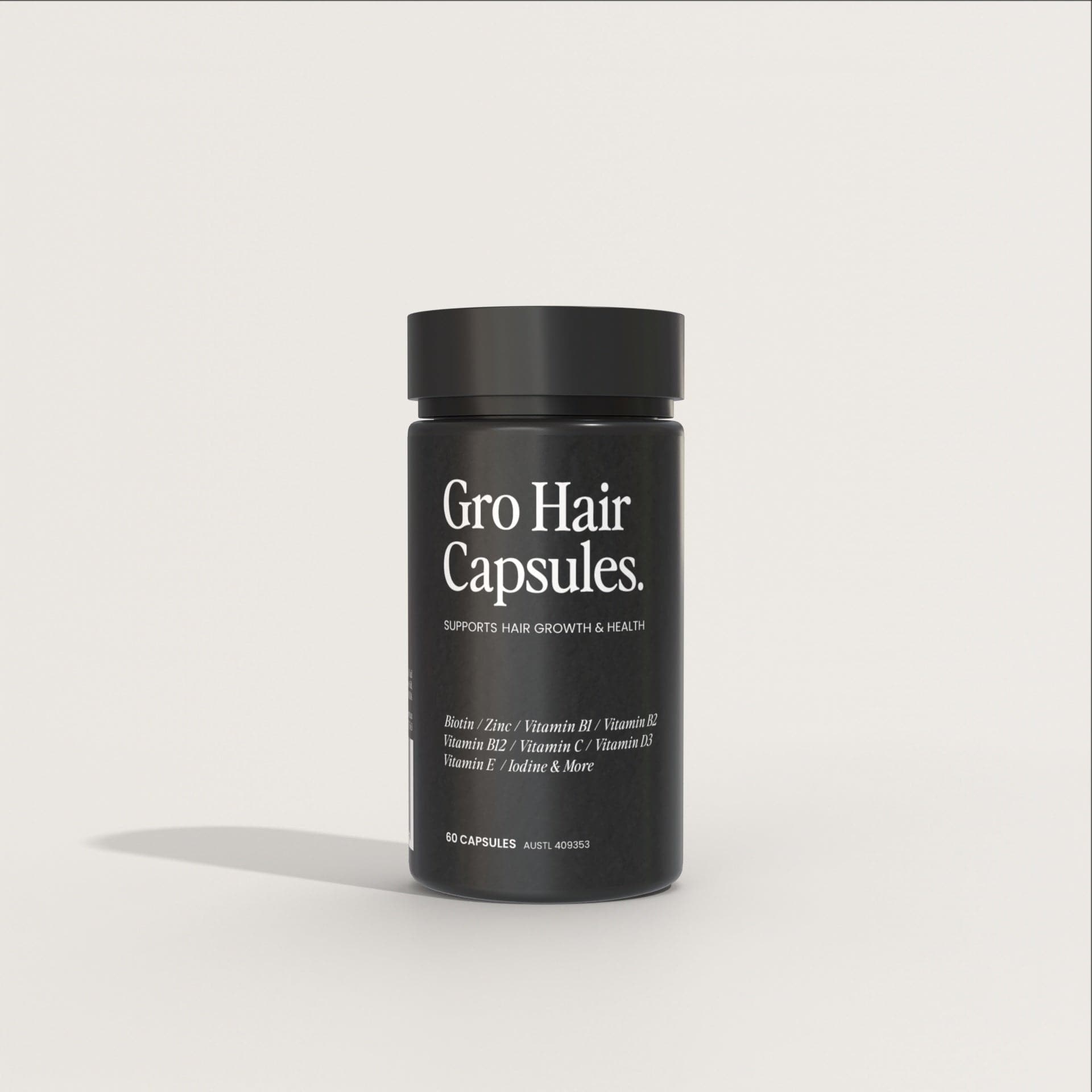 A black bottle labeled "Gro Hair Capsules: Hair Growth Supplements Australia" on a plain white background. The label states "Supports Hair Growth & Health" for thicker, stronger, healthier hair and lists ingredients including Biotin, Zinc, Vitamin B1, Vitamin B2, Vitamin B6, Vitamin B12, Vitamin E, Iodine and more.