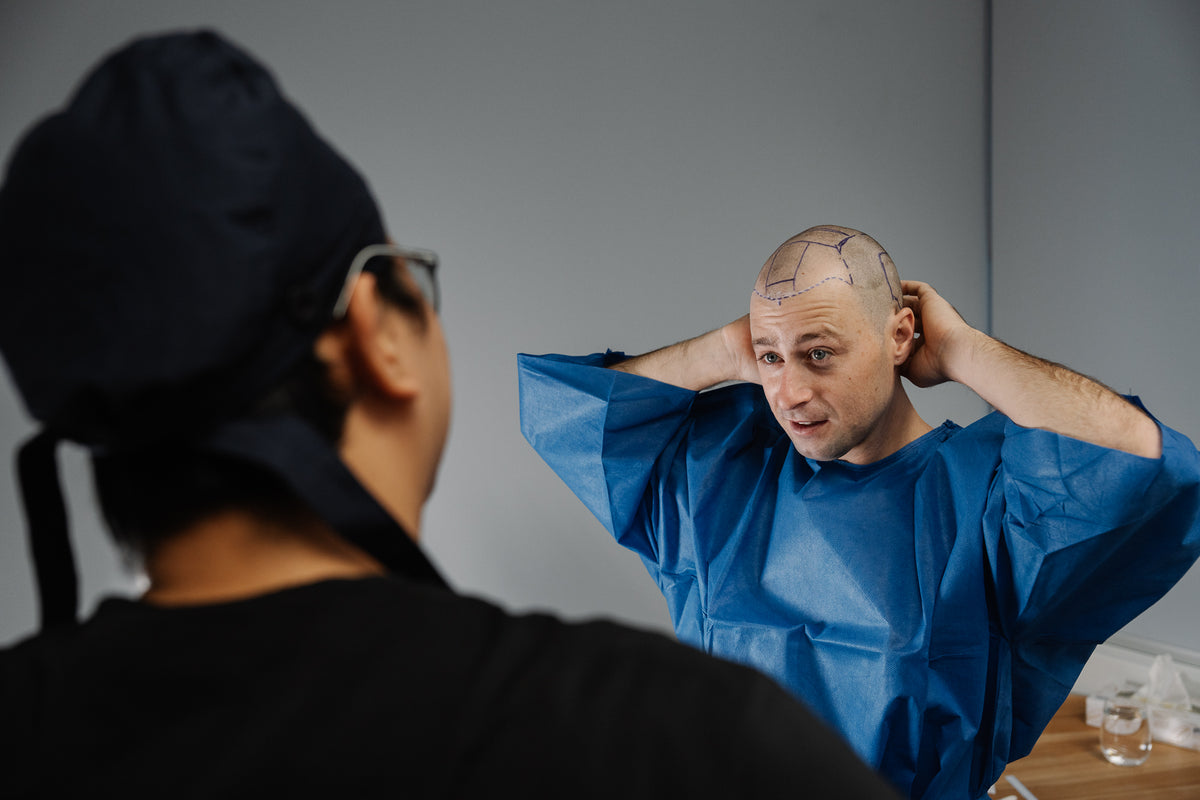 A Gro treating doctor marking out a hairline plan